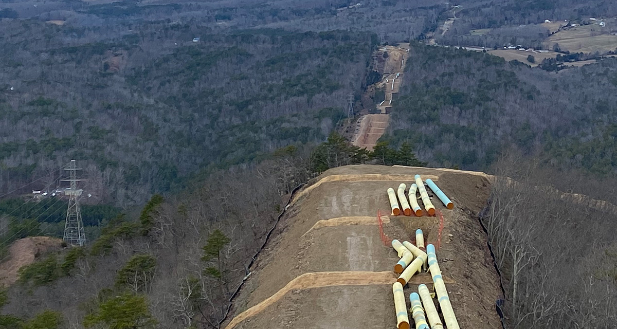 An Equitrans right-of-way clearing has staged pipeline equipment for construction, shown as an aeriel view.